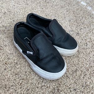 Black Vans slip on